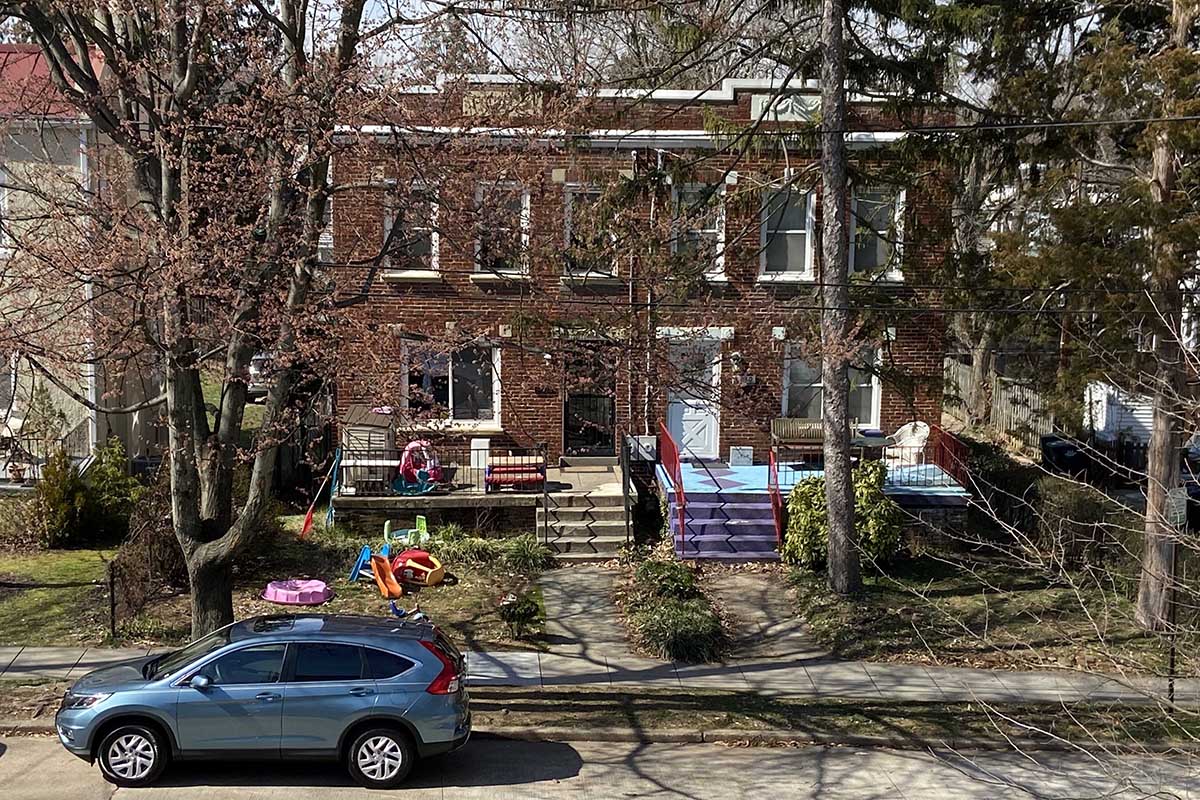 home in NW D.C. with toys on the lawn